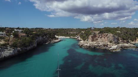 Boat-Anchored-Outside-Cala-Llombards-Beach,-Mallorca