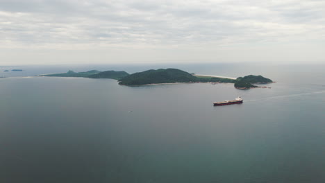 Cargo-ship-sailing-in-Paranagua-Bay-off-the-coast-of-Ilha-do-Mel,-Paraná,-Brazil