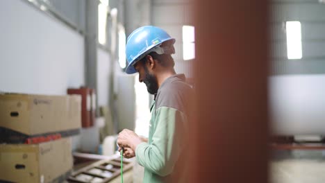 Workers-working-inside-textile-industry-in-Pakistan-on-electric-works