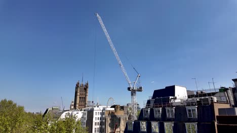 Construction-Crane-Towering-Above-Millbank-Over-New-Redevelopment-In-Westminster-On-Sunny-Morning-With-Blue-Skies