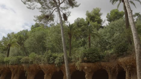 Scenic-artchitrctural-pathway-of-Pòrtic-de-la-Bugadera-in-the-Parc-Güell,-Barcelona,-Tourist-attraction