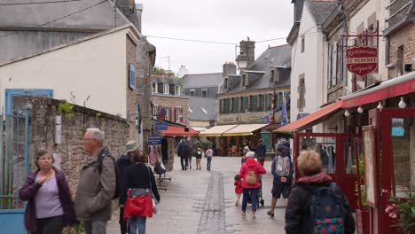 People-on-Pedestrian-Street-in-Concarneau,-Brittany,-France,-Old-Walled-City,-Slow-Motion