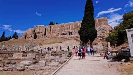Tourists-Visiting-Remains-Of-Ancient-Greek-Monuments-In-The-Acropolis-of-Athens-In-Greece