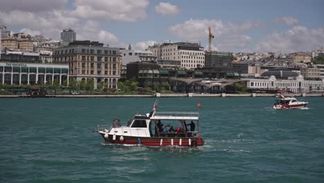 Ships,-ferries,-boats,-historical-buildings-in-the-Bosphorus,-Istanbul,-Turkiye