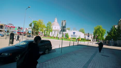 Daugavpils-city-centre-street-view-with-central-Church-traffic-and-people