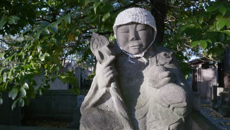 Japanese-statue-with-a-cap-knitted-by-one-of-the-temple's-devotees