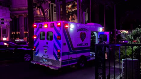 Las-Vegas-USA,-Community-Ambulance-Vehicle-With-Emergency-Lights-on-Strip-at-Night