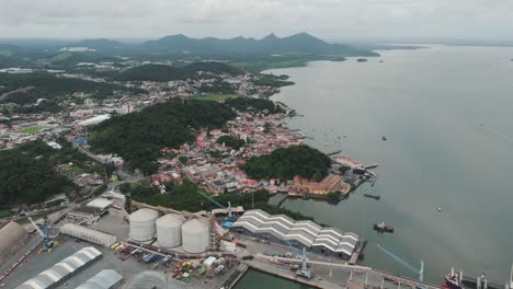 Aerial-view-of-the-port-of-São-Francisco-do-Sul,-bulk-storage-structures-and-urban-area