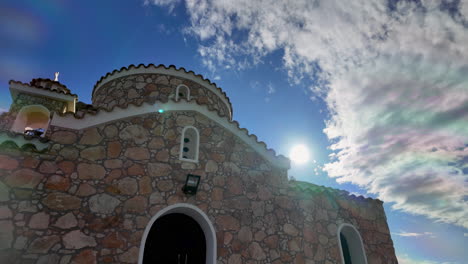Stone-church-building-with-a-cloudy-sky-background,-Cyprus-Protaras