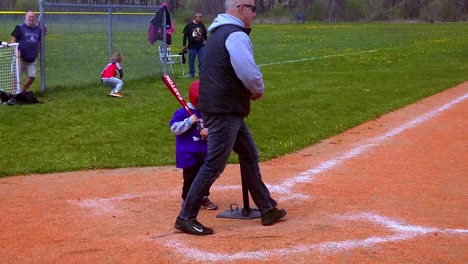 Boy-standing-at-the-plate-for-first-T-ball-practice-in-Portland,-Maine