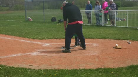 Young-boy-having-trouble-hittind-the-T-ball-in-South-Portland,-Maine