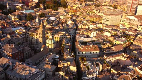 Golden-sunset-light-over-Genoa's-historical-center-with-a-panoramic-drone-view