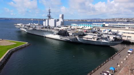 USS-Midway-Museum-and-Naval-Ship-in-San-Diego-Harbor-in-aerial-dolly-in-view