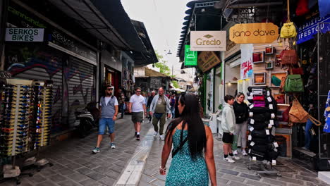 Crowded-touristic-square-in-Monastiraki,-oldest-neighborhoods-of-Athens-at-dusk---eye-view-shot