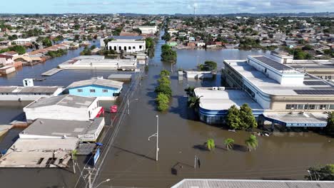 City-covered-in-flood-water,-emergency-services,-hospital-building,-aerial