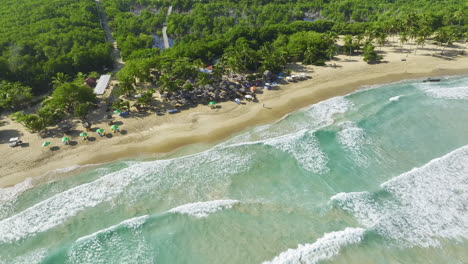 Waves-On-A-White-Sand-Shore-Of-Bávaro-Beach-Resorts-In-Punta-Cana,-Dominican-Republic