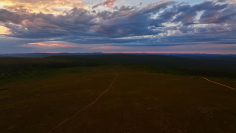 Aerial-view-over-endless-wilderness-of-UKK-national-park,-moody-evening-in-Finland