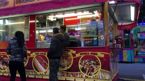 Motion-of-people-buying-food-at-booth-at-the-West-Coast-Amusements-Carnival-with-4k-resolution