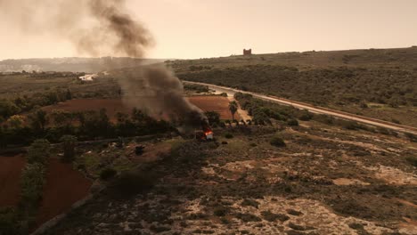 Push-out-shot-of-a-house-on-fire-in-Malta,-Ramla-Bay