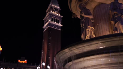 Las-Vegas-USA,-Venetian-Tower-and-Fountain-at-Night,-Famous-Strip-Casino-Hotel-Landmarks