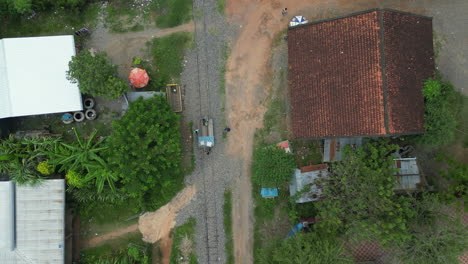 Bamboo-Railway-End-Of-The-Line-And-Mechanic-Shed-In-Cambodia-Birdseye-Drone