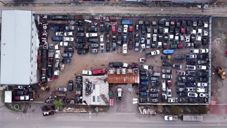 Top-down-drone-shot-of-the-wrecked-car-yard