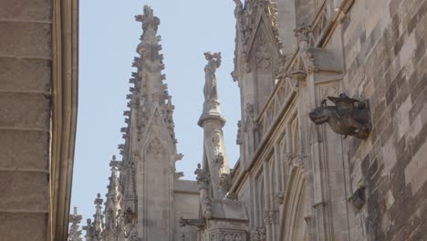 Scenic-exterior-view-of-the-Cathedral-of-the-Holy-Cross-and-Saint-Eulalia-statue-in-Barcelona