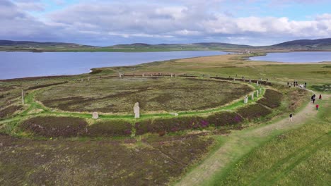 Aerial-View,-Ring-of-Brodgar,-Prehistoric-Landmark-and-Tourists,-Stromness,-Orkney,-Scotland-UK-60fps