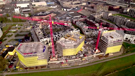 Aerial-top-down-slow-ascending-showing-real-estate-project-new-housing-construction-site-part-of-urban-development-Noorderhaven-neighbourhood