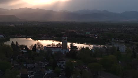 Aerial-footage-of-Lakewood-and-the-mountains-during-sunset