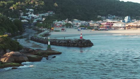 Aerial-view-of-lighthouses-at-the-entrance-to-the-Barra-Da-Lagoa-canal