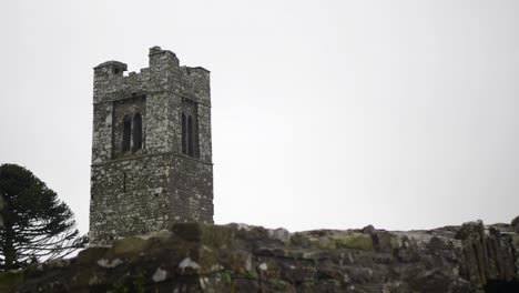 Medieval-church-tower-on-the-Hill-of-Slane-under-a-cloudy-sky-in-County-Meath,-Ireland