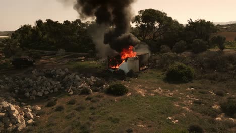 Static-shot-of-a-house-fire-in-Malta,-Ramla-Bay