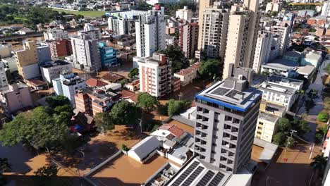 City-engulfed-in-water,-environmental-disaster-South-America,-aerial