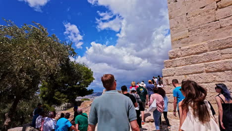 Monument-of-Agrippa-Pedestal-tourist-point-of-view-Acropolis-Parthenon-in-Athens-Greece