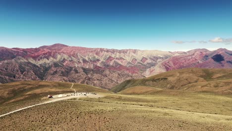 Aerial-revealing-shot-of-the-natural-rock-formation-at-the-Hill-of-14-Colors