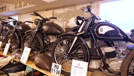 Rows-of-vintage-Cspel-motorcycles-on-display-in-motor-vehicle-museum