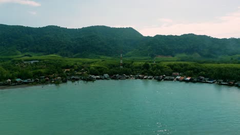 4K-Cinematic-nature-drone-footage-of-a-panoramic-aerial-view-of-the-beautiful-beaches-and-mountains-on-the-island-of-Koh-Lanta-in-Krabi,-South-Thailand,-on-a-sunny-day-over-the-old-town-of-Lanta