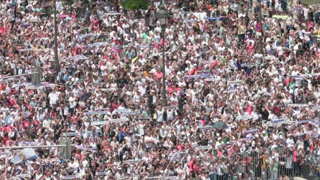 Thousands-of-Real-Madrid-fans-gathered-take-the-street-at-Cibeles-Square-to-celebrate-with-Real-Madrid-players-the-36th-Spanish-soccer-league-title,-La-Liga-trophy-in-Madrid,-Spain