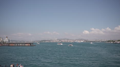 Ships,-ferries,-boats,-historical-buildings-in-the-Bosphorus,-Istanbul,-Turkiye