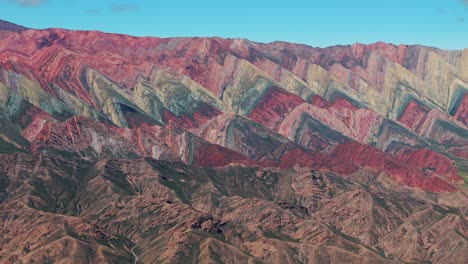 Slow-aerial-establishing-shot-of-the-triangular-formations-at-the-Hill-of-14-Colors