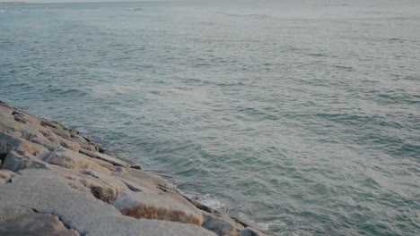 Rocky-edge-at-Ovar-beach-with-gentle-sea-waves