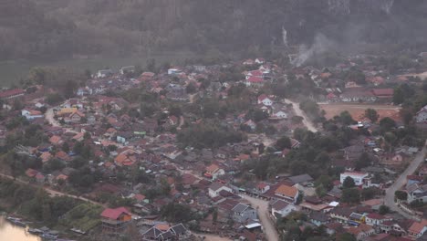 aerial-shot-of-remote-village-in-the-mountain-town-of-Nong-Khiaw-in-Laos,-Southeast-Asia