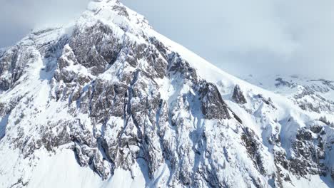 Orbit-Shot-Of-High-rise-Fronalpstock-Glarus-Snowy-Mountains,-Switzerland