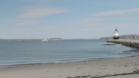 Spring-point-ledge-light-house-at-the-end-of-a-rock-pier-on-the-Atlantic-Ocean