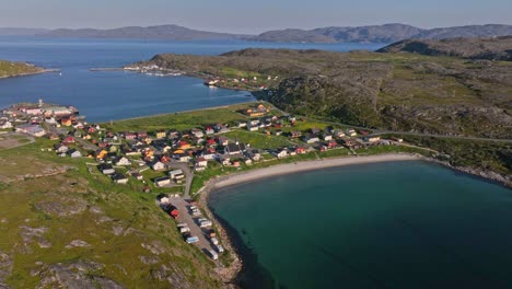 Vestersanden-beach-and-the-Bogoynes-town,-sunset-in-north-Norway---Aerial-tracking-shot