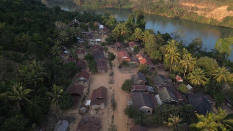 drone-shot-of-remote-village-in-the-mountain-town-of-Nong-Khiaw-in-Laos,-Southeast-Asia