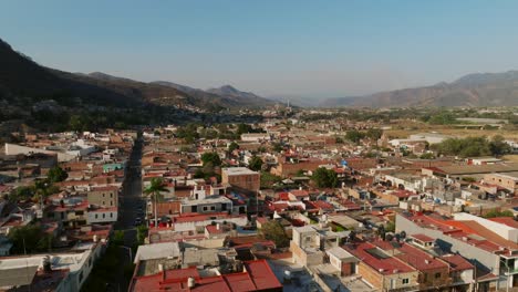 Aerial-flight-over-a-residential-area-in-Tamazula-de-Gordiano,-Mexico,-during-daytime