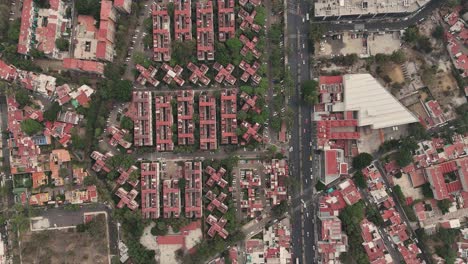 Slow-motion-aerial-view-of-a-housing-complex-in-Coyoacan,-showcasing-geometric-architecture,-Mexico-City