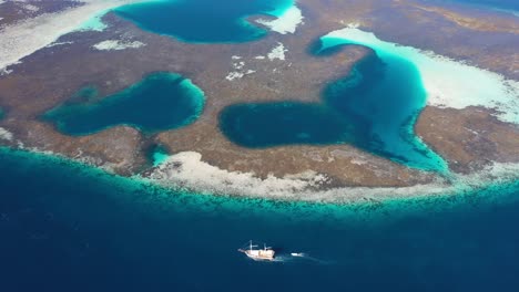 Aerial-view-of-coral-reef-in-Taka-Makassar,-Komodo-National-Park,-Indonesia